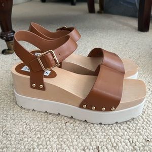 Wooden platform with leather strap heels